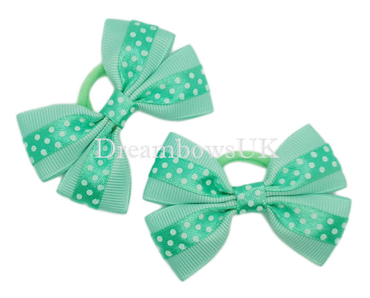 Pastel green polka dot bows on polyester bobbles