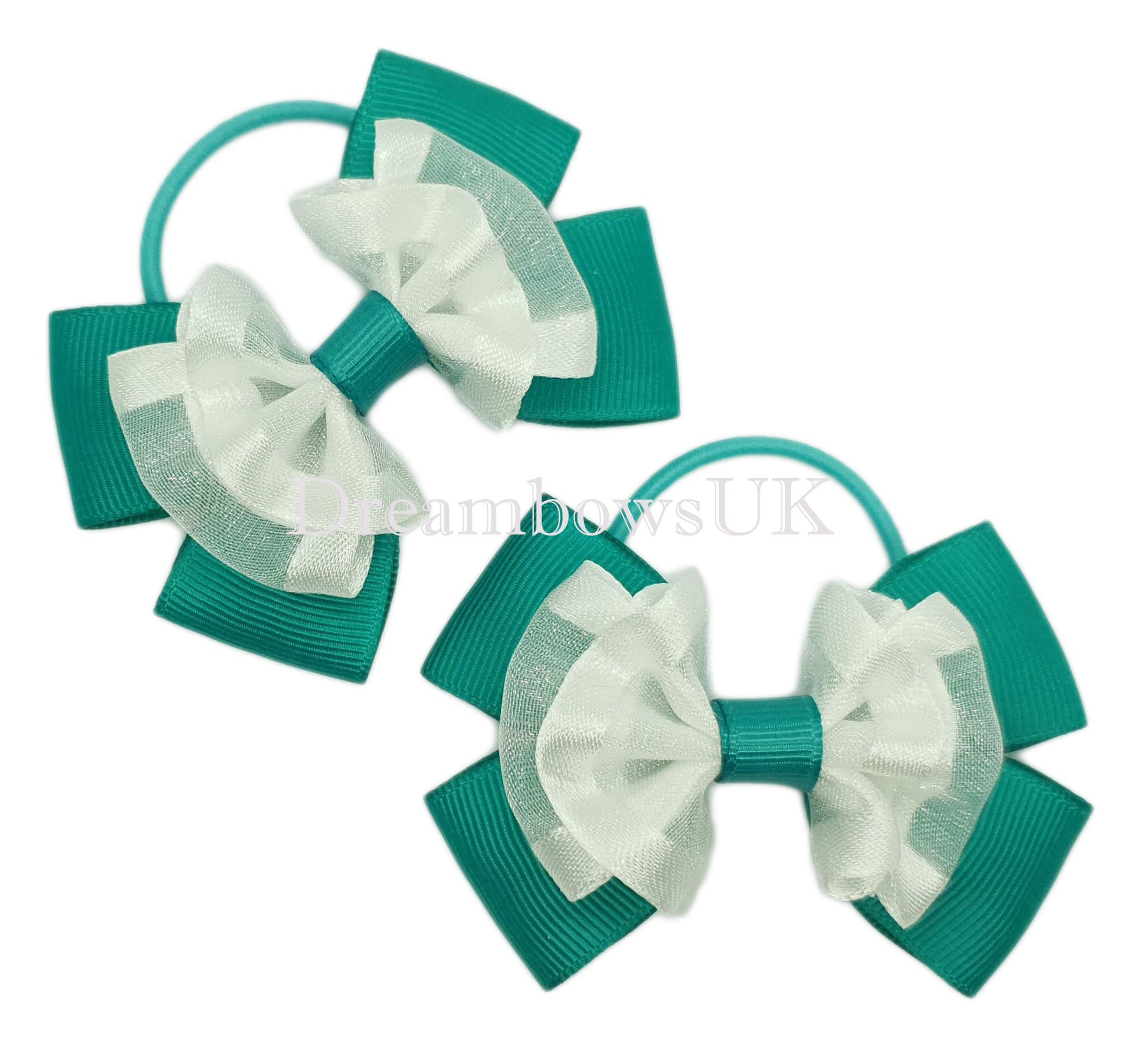 Jade green and white school bows on thin bobbles