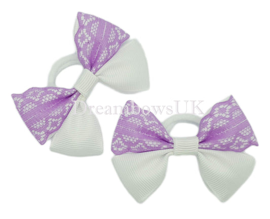Purple and white lace bows on polyester bobbles