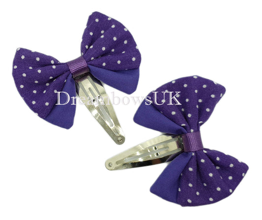 Purple polka dot hair bows on snap clips