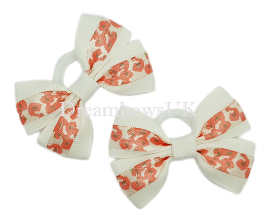 Red and white floral hair bows on polyester bobbles