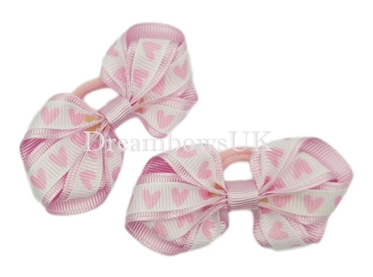 Baby pink hearts design hair bows on polyester bobbles