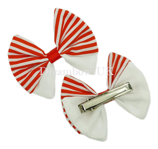 Red and white striped bows on alligator clips