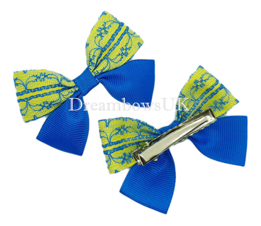 Royal blue and yellow school bows on alligator clips