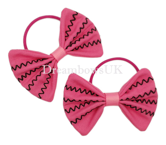 Embroidered bows on thin bobbles
