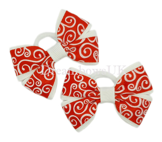 Red and white novelty design hair bows on polyester bobbles