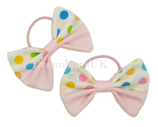Baby pink polka dot hair bows on thin bobbles