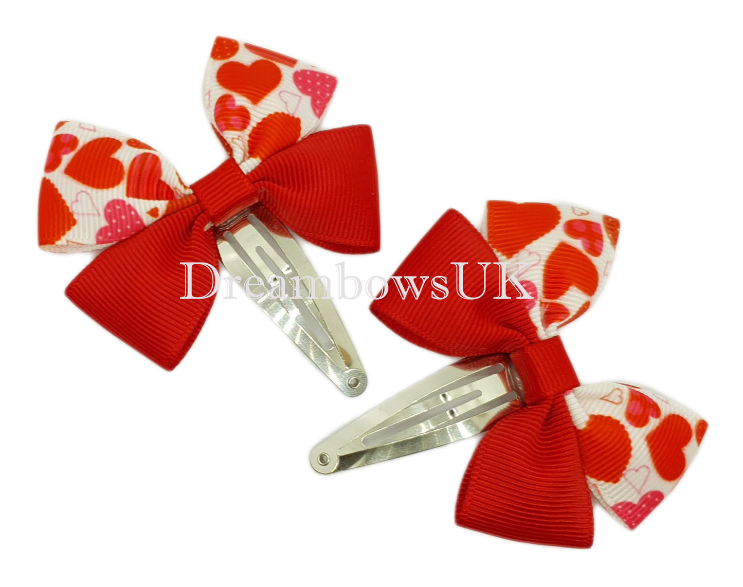 Red and white hearts design hair bows on snap clips