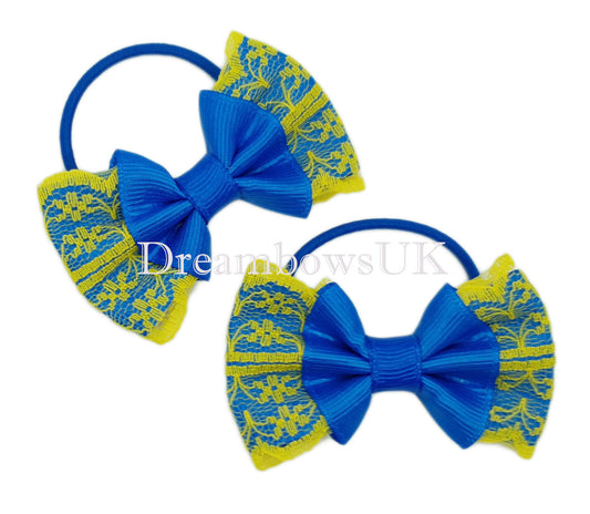 Royal blue and yellow lace hair bows on thin bobbles