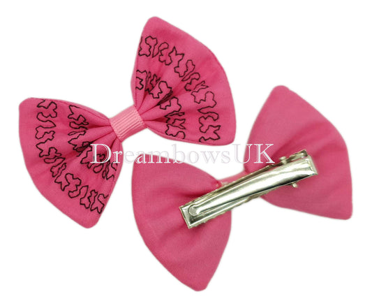 Pink embroidered hair bows on alligator clips