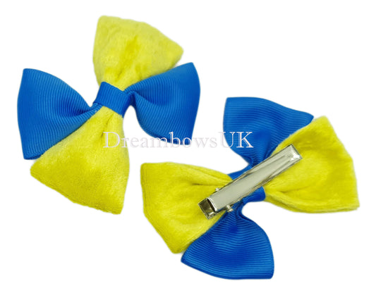 Royal blue and yellow velvet hair bows on alligator clips
