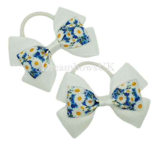 Blue and white floral hair bows on thin bobbles