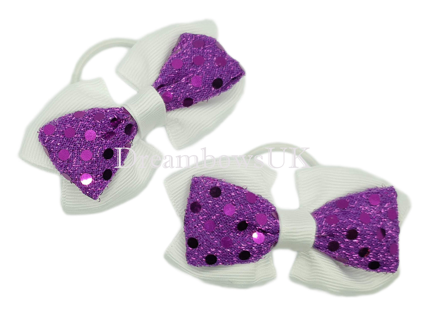 Purple and white diamante hair bows on thin bobbles