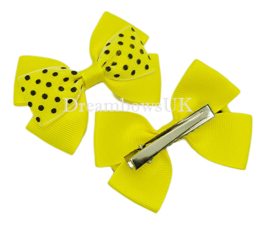 Yellow polka dot hair bows on alligator clips