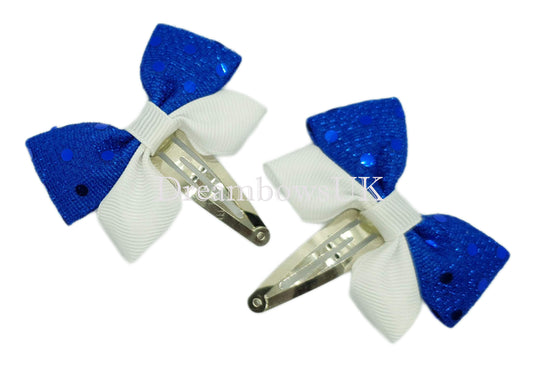 Royal blue and white diamante hair bows on snap clips