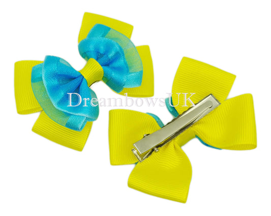 Turquoise and yellow organza hair bows on alligator clips