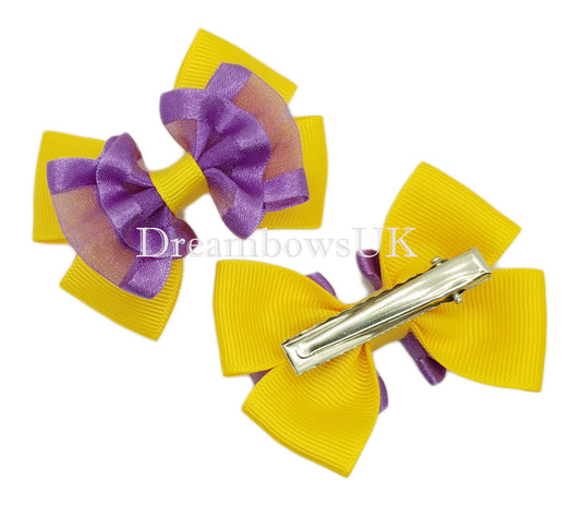 Purple and golden yellow organza hair bows on alligator clips