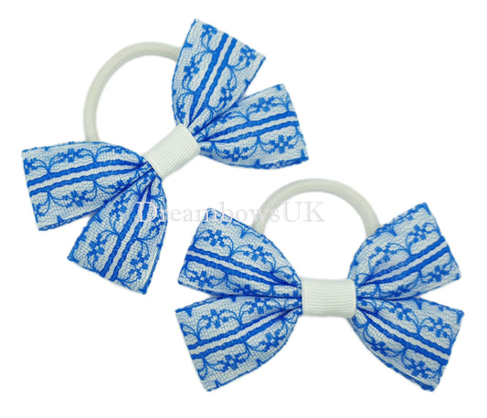 Royal blue and white school bows on thick bobbles