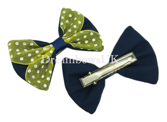 Navy blue and yellow polka dot hair bows on alligator clips
