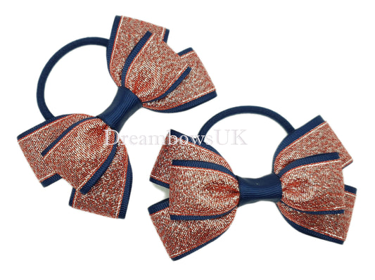 Navy blue and red glitter bows on thick bobbles