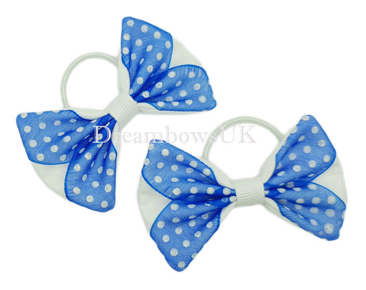 Royal blue and white polka dot hair bows on thin bobbles
