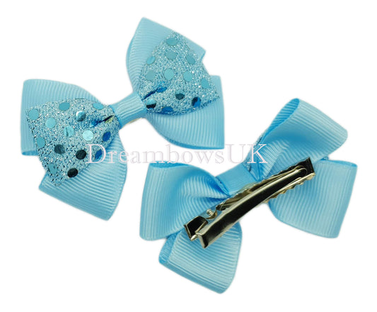 Baby blue diamante hair bows on alligator clips