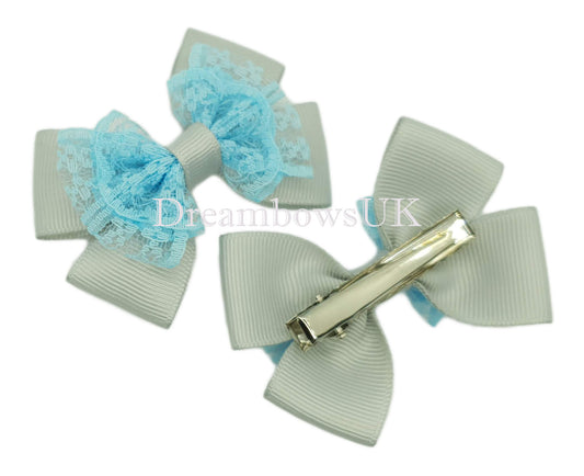 Silver and baby blue lace bows on alligator clips