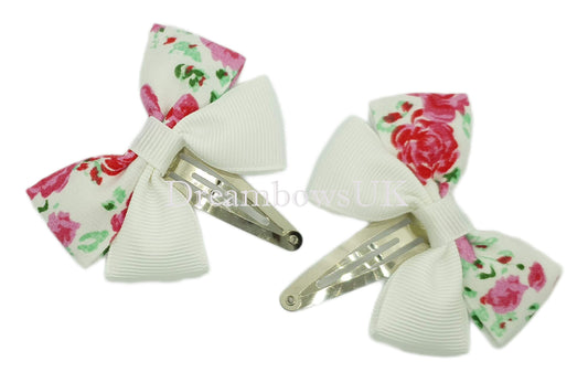 Pink and white floral hair bows on snap clips