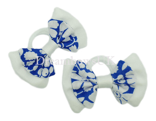 Royal blue and white floral hair bows on polyester bobbles