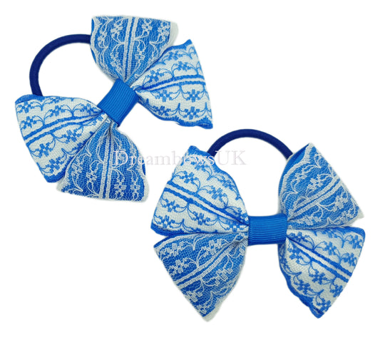 Royal blue and white lace hair bows on thick bobbles