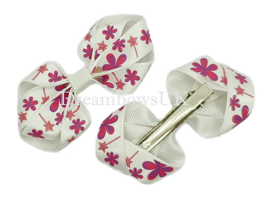 Purple and white floral bows on alligator clips