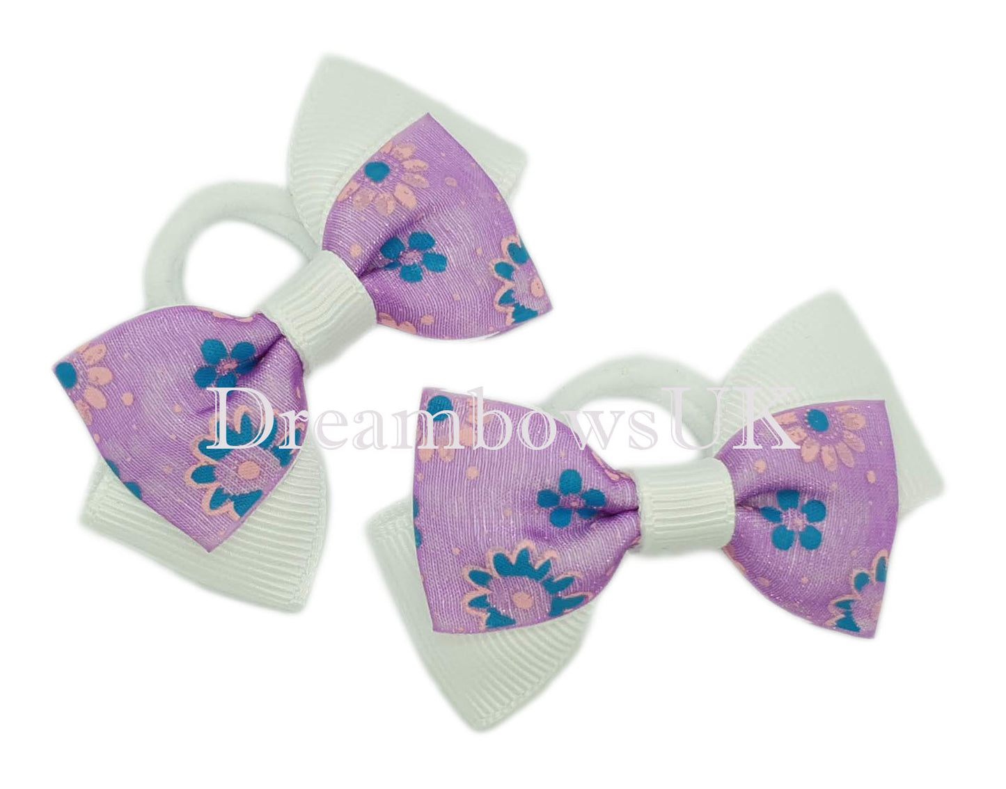 Purple and white floral hair bows on polyester bobbles