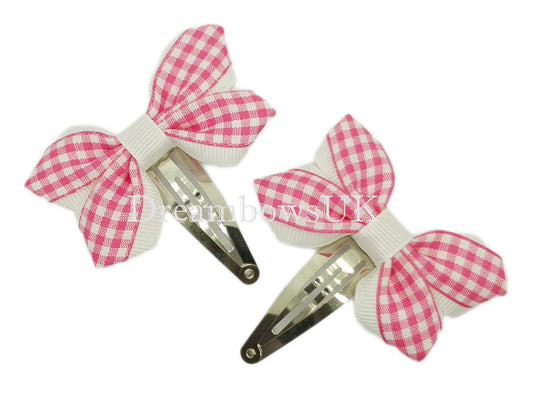 2x Pink gingham hair bows on snap clips