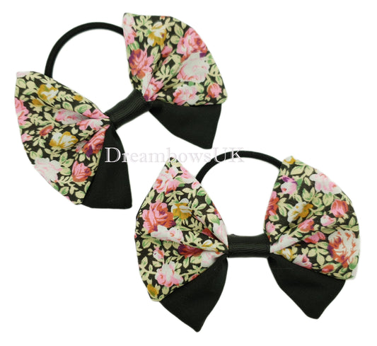 Black and pink floral fabric hair bows on thick bobbles
