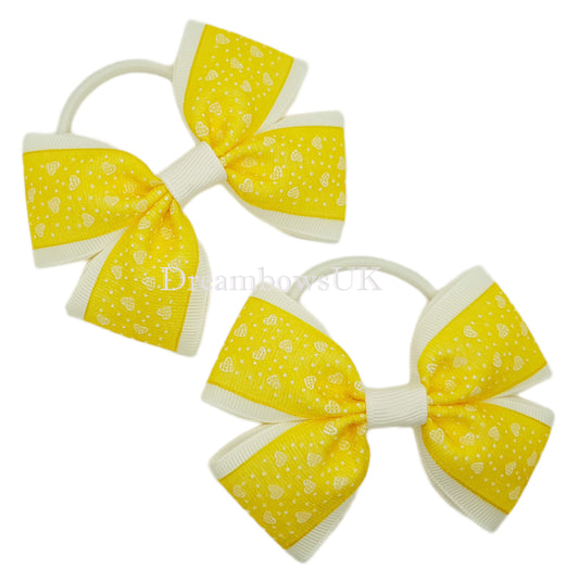 Yellow and white hair bows, thick bobbles