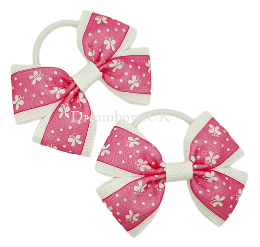 Cerise pink and white butterfly design hair bows on thick bobbles
