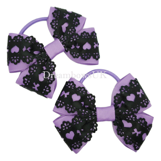 Black and purple hair bows on thick bobbles