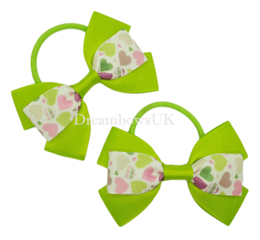 Lime green hearts design hair bows on thick bobbles