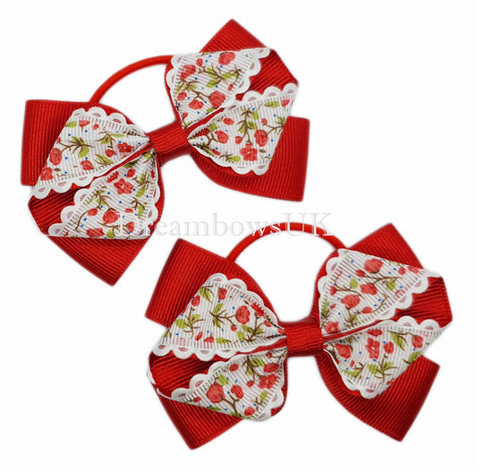 Girls red floral hair bows on thin bobbles 