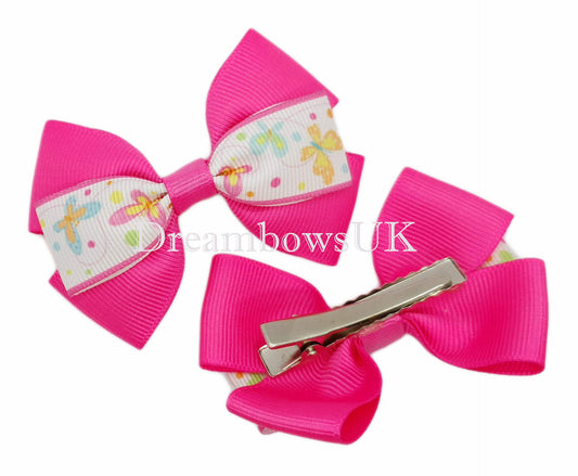 Bright pink butterfly hair bows on alligator clips