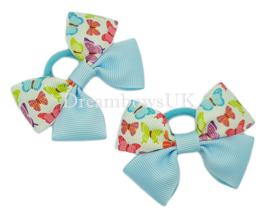 Baby blue butterflies design bows on polyester bobbles