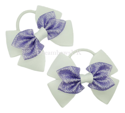 Purple and white glitter hair bows on thick bobbles