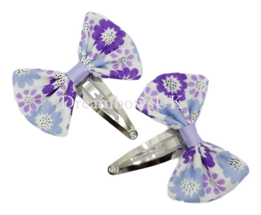 Purple floral hair bows on snap clips