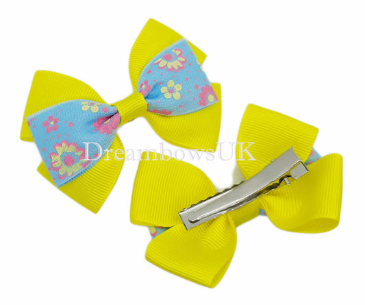 Girls yellow and baby blue floral hair bows on alligator clips