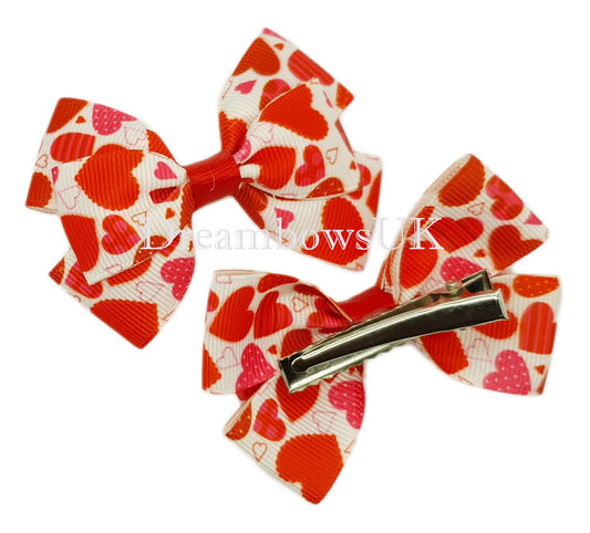 Red and white hearts design bows on alligator clips