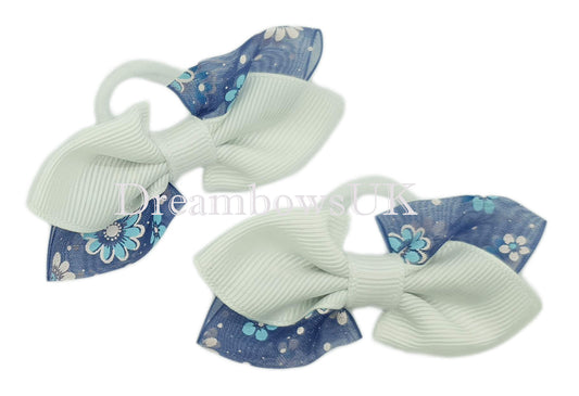 Navy blue and white floral hair bows on polyester bobbles