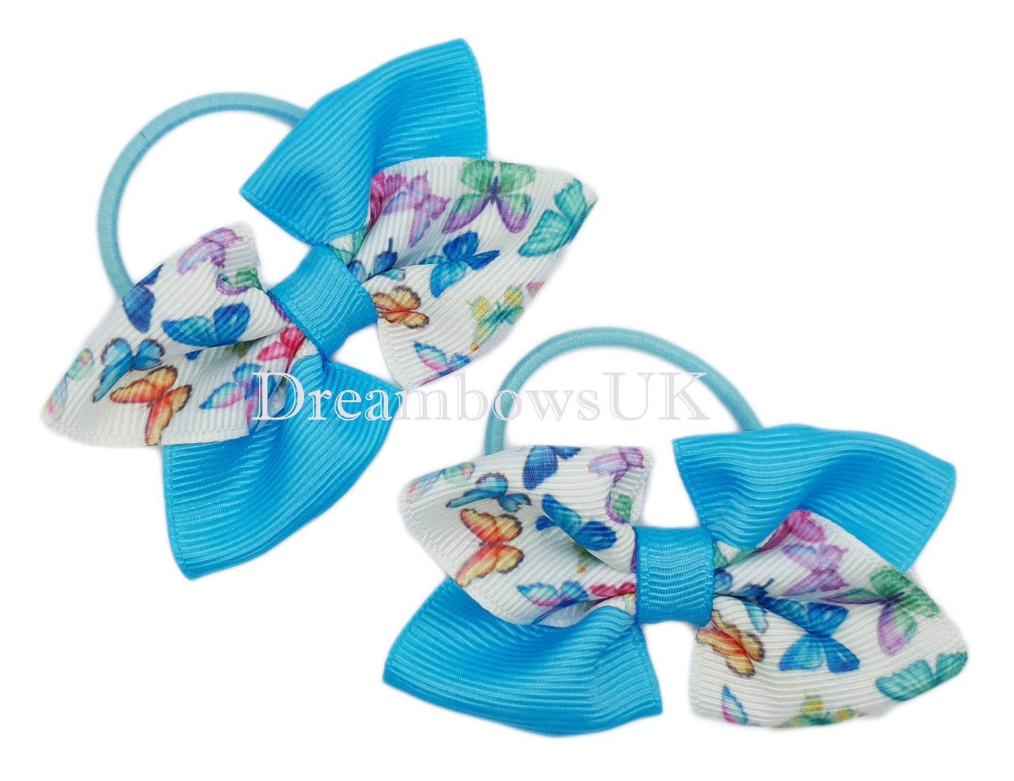 Turquoise and white hair bows on thin bobbles