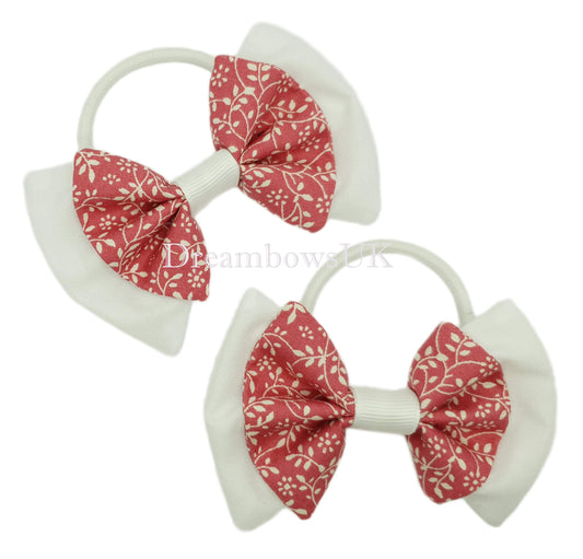 Candy pink and white floral fabric hair bows on thick bobbles