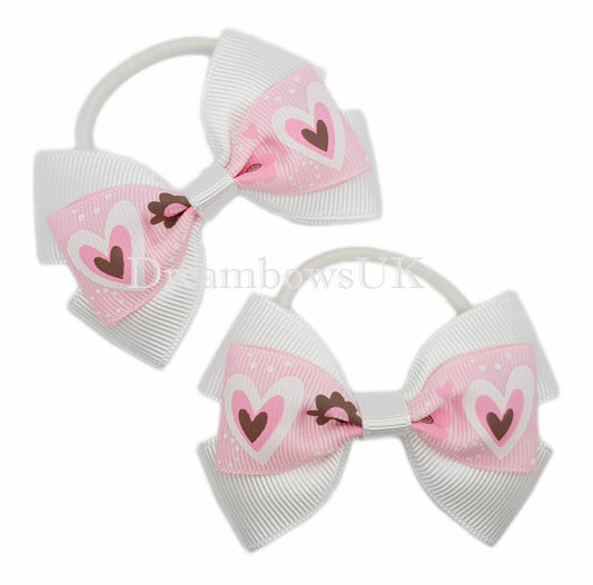 Baby pink and white bows on thin bobbles