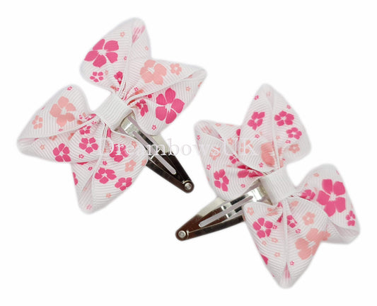 Pink and white floral hair bows, snap clips